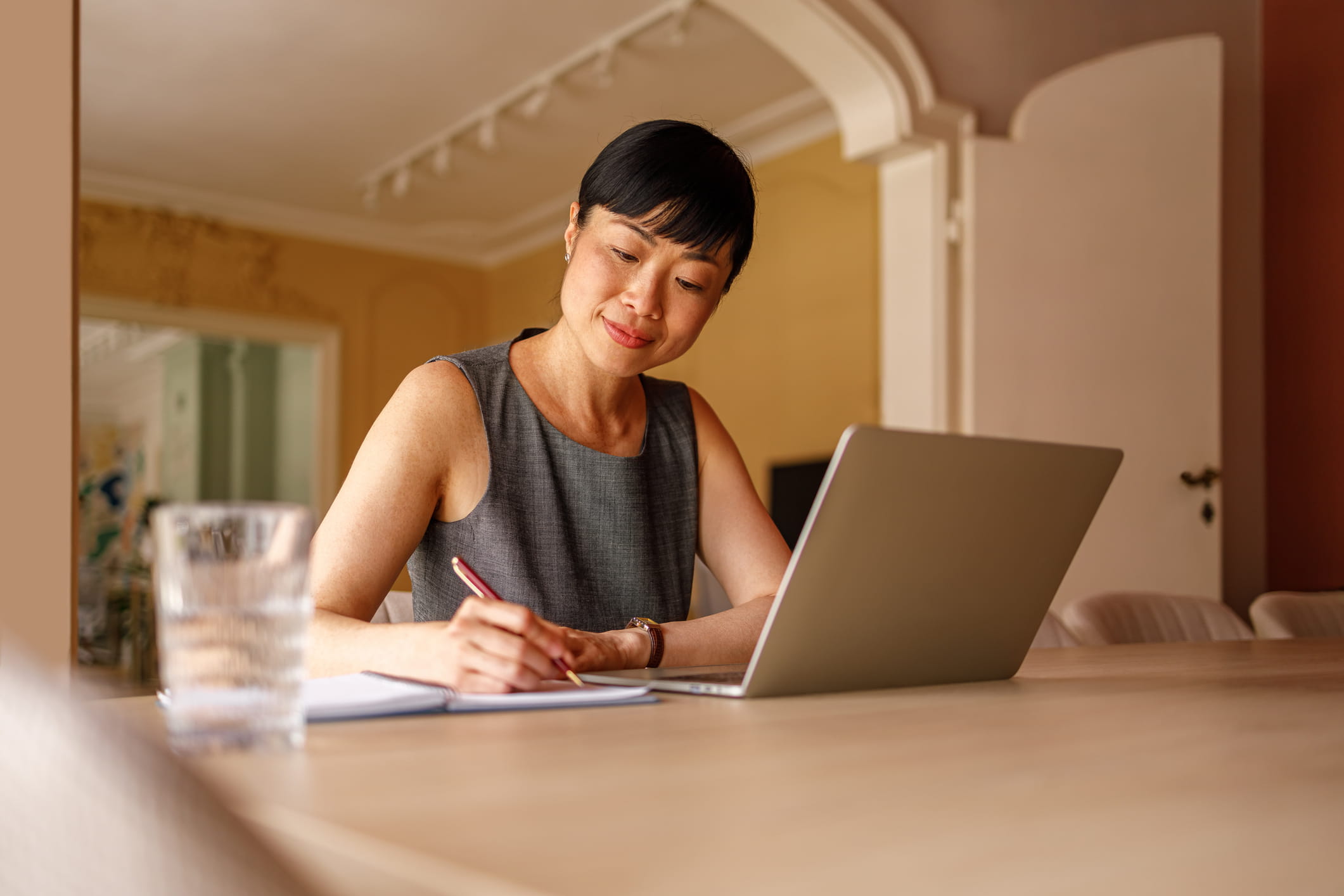 woman sitting at desk researching attorneys