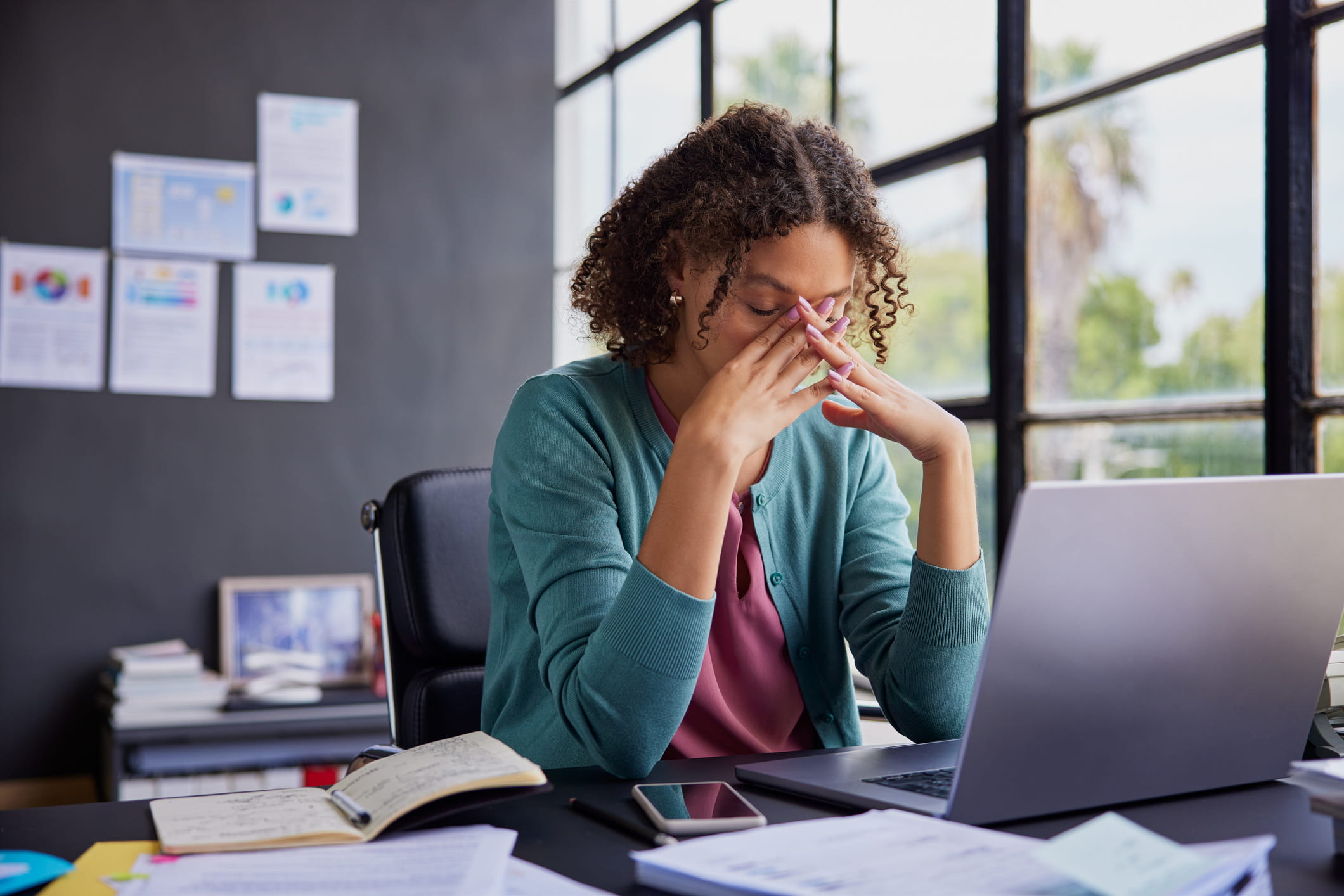 frustrated woman sitting at desk
