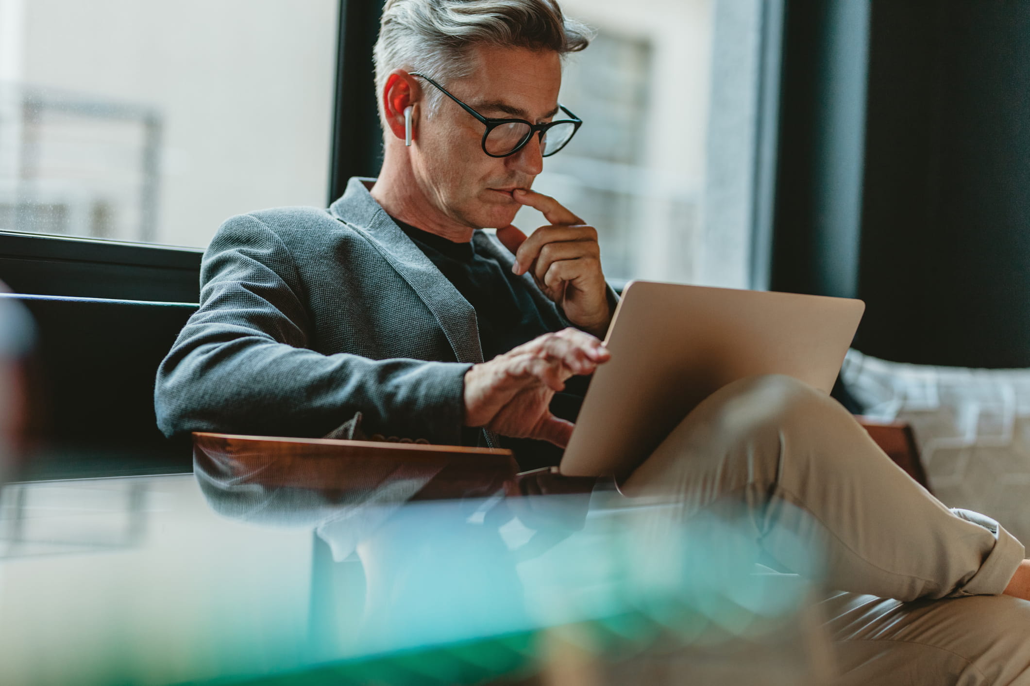 middle aged business man looking at computer